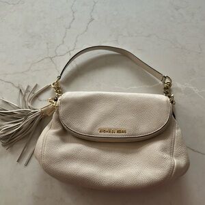 12 x 9 cream shoulder bag. Excellent condition, one little mark shown in photo.